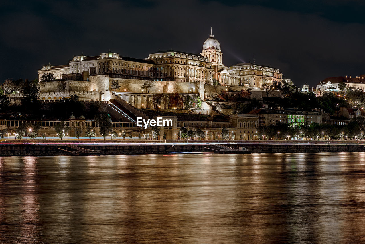 Illuminated royal palace of buda against sky at night