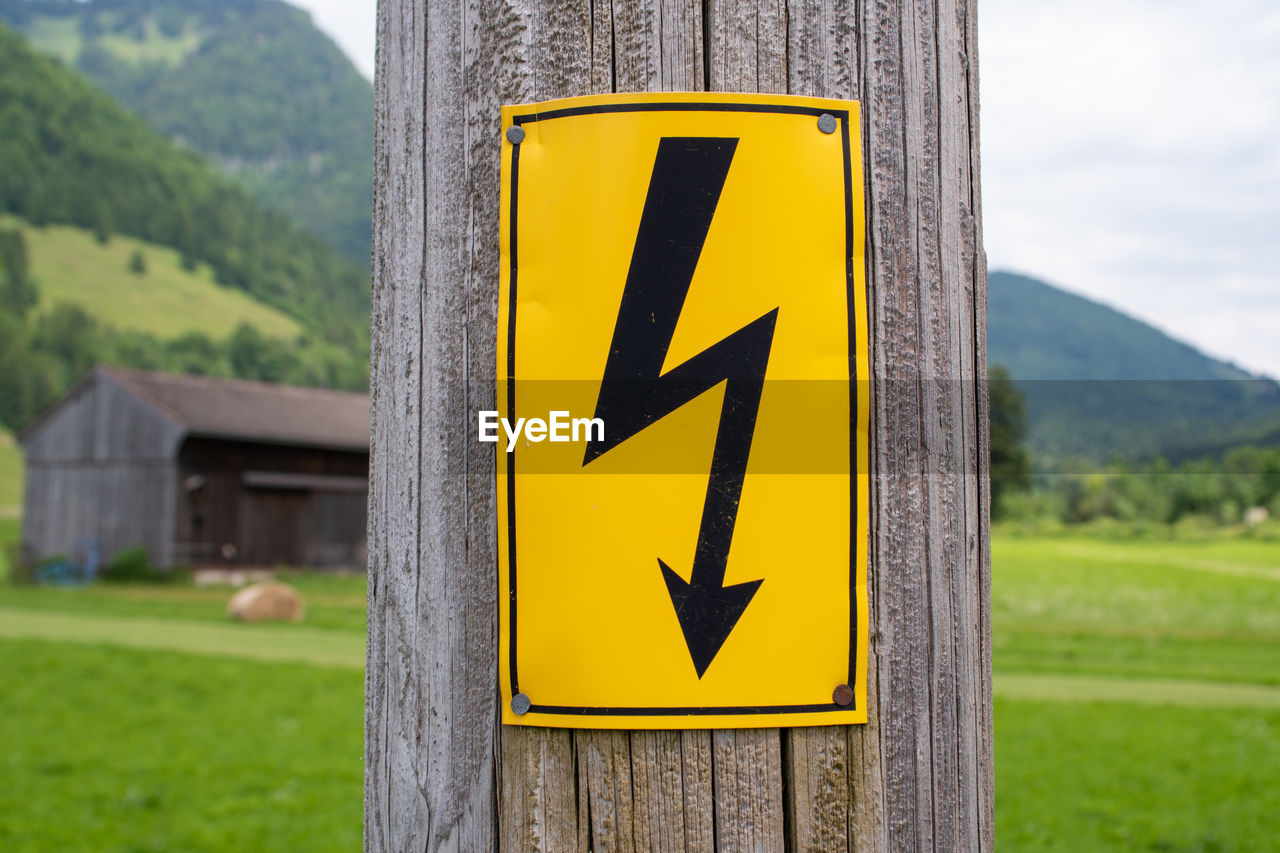 Close-up of electric sign on a utility pole 