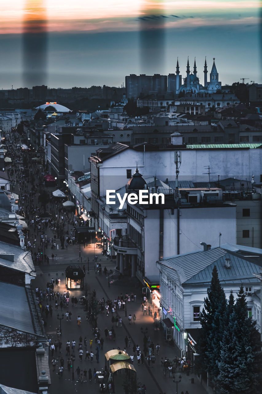 High angle view of illuminated city buildings at dusk