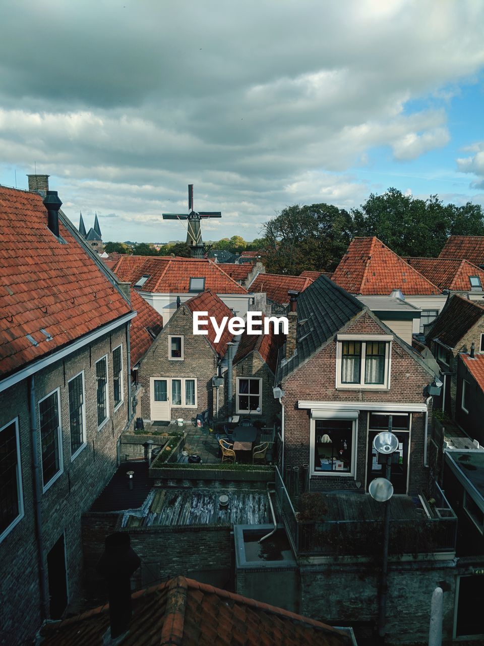 Houses in town against sky