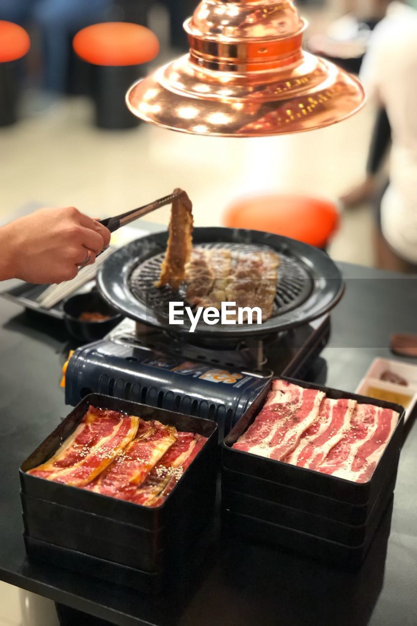 Midsection of person preparing food on table