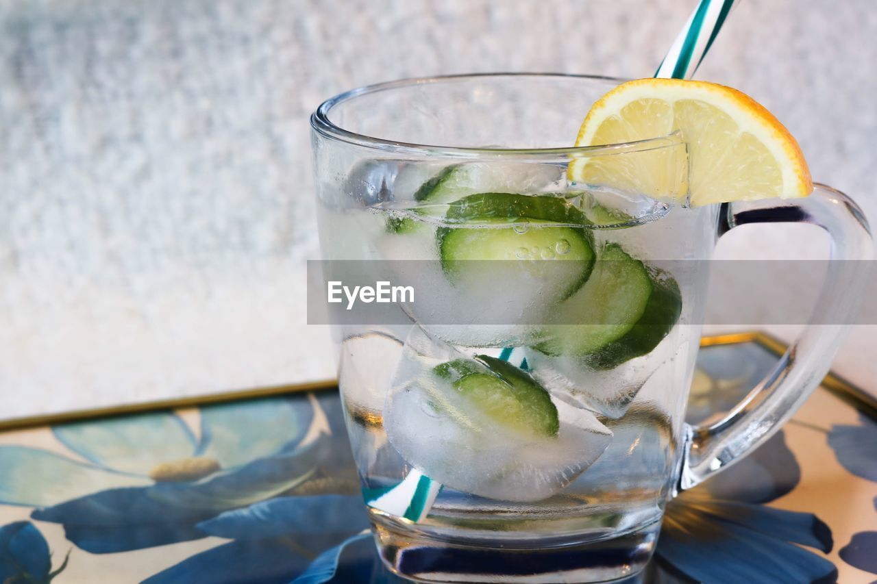 CLOSE-UP OF ICE CREAM IN DRINKING GLASS ON TABLE