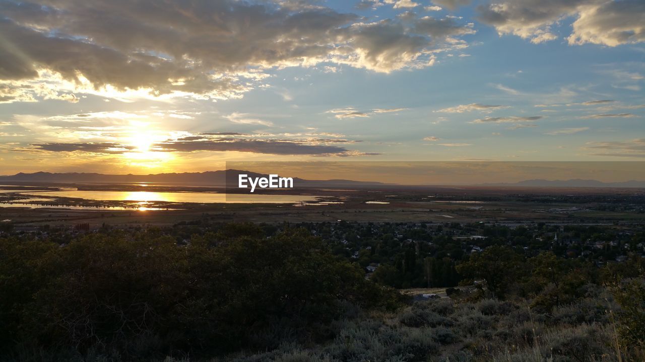 Scenic view of landscape against sky during sunset