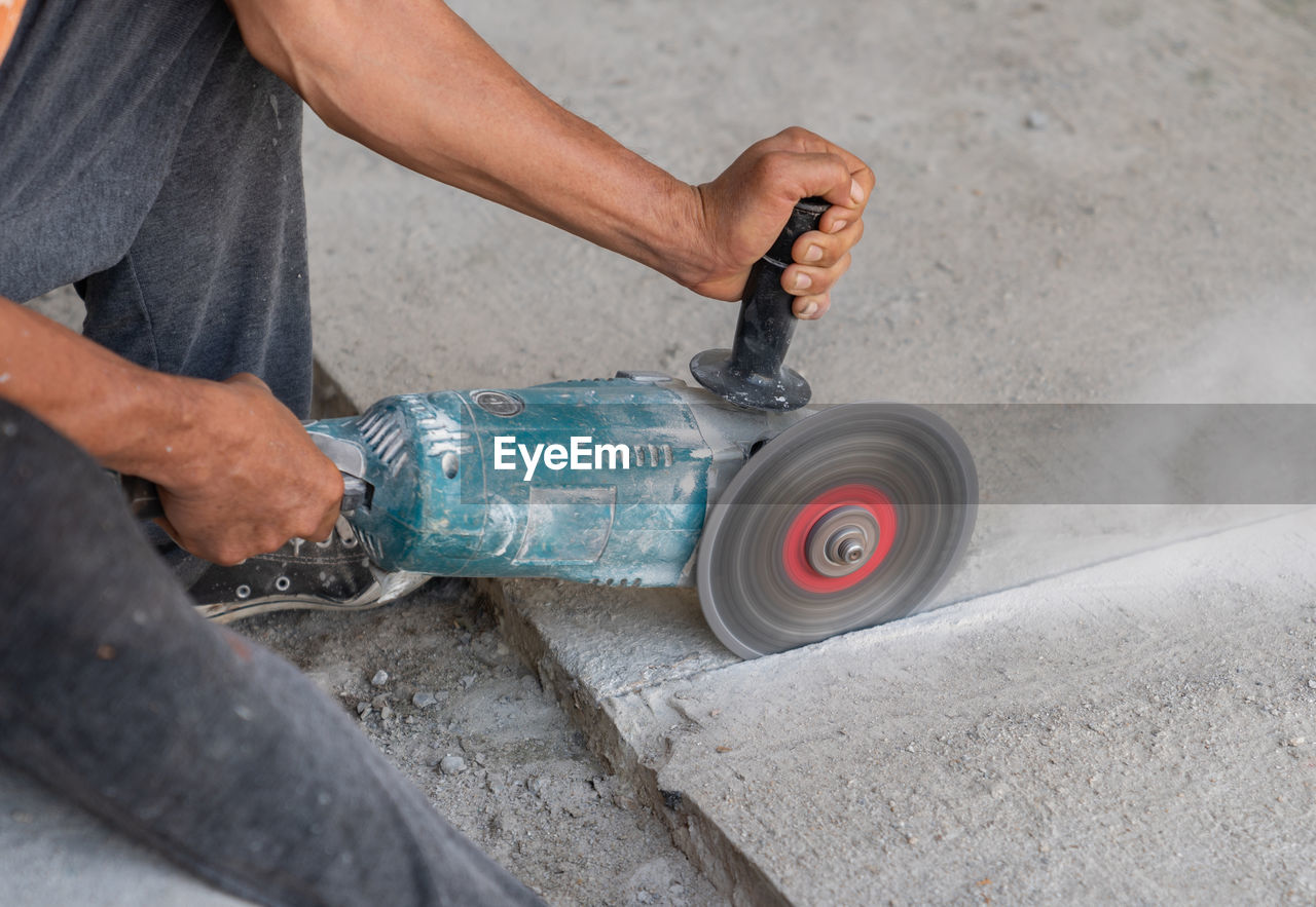 low section of man working at workshop