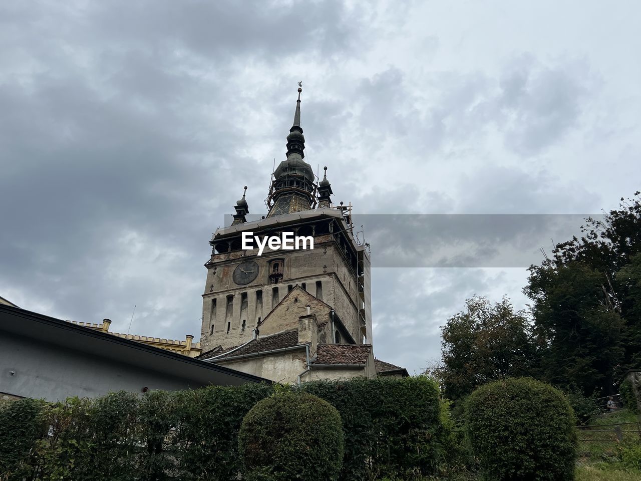 architecture, built structure, building exterior, sky, cloud, plant, tree, building, nature, travel destinations, history, the past, landmark, tower, travel, no people, château, religion, low angle view, tourism, outdoors, day, place of worship, city, belief, overcast, spirituality