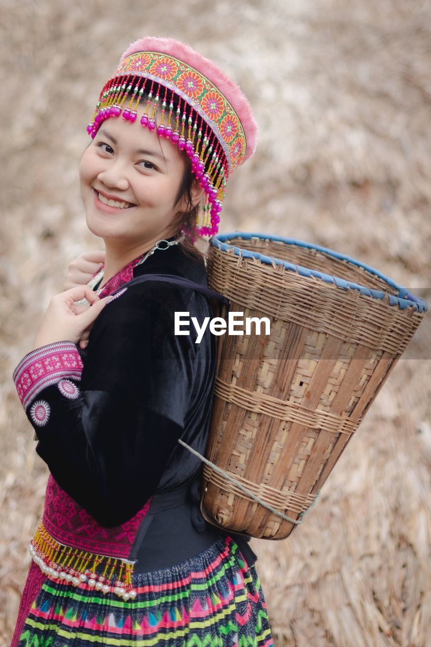 Portrait of smiling young woman wearing traditional clothing outdoor