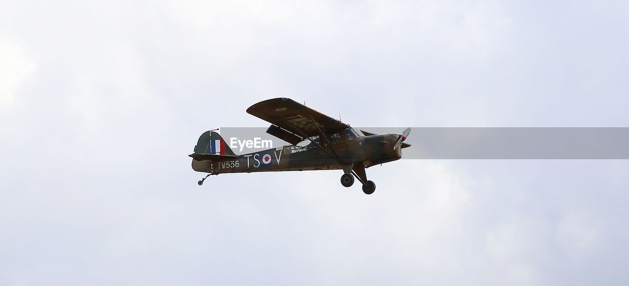 LOW ANGLE VIEW OF AIRPLANE IN SKY