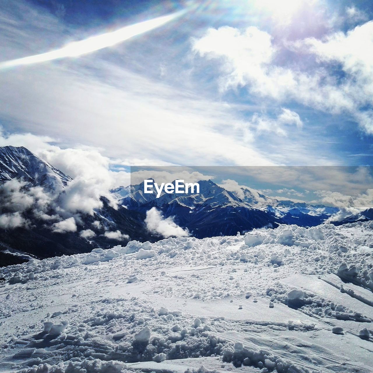 Scenic view of snow mountains against sky