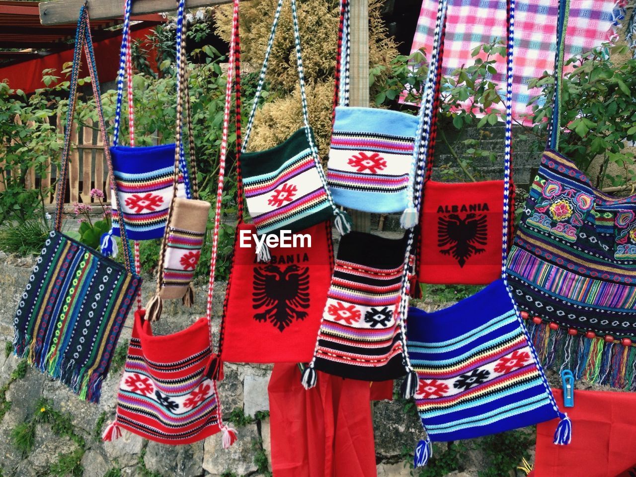 Woolen purses hanging from market stall