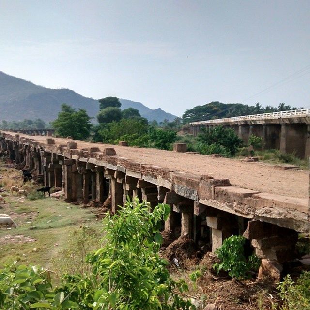 VIEW OF BRIDGE OVER MOUNTAINS