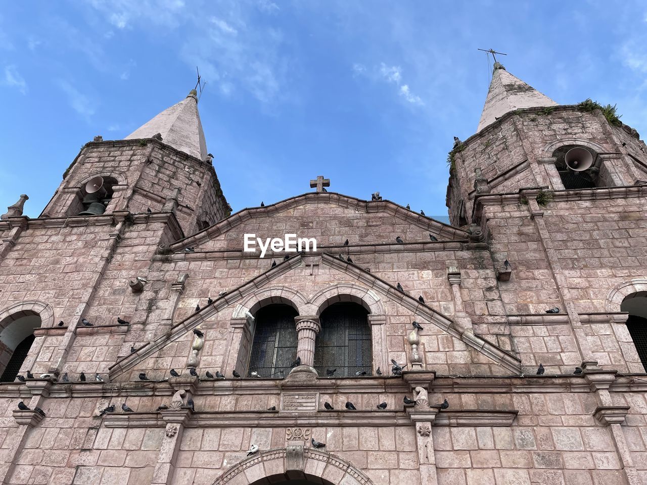 architecture, built structure, building exterior, place of worship, religion, belief, spirituality, sky, travel destinations, building, history, the past, catholicism, medieval architecture, low angle view, nature, tower, worship, travel, no people, arch, tourism, facade, cloud, day, city, outdoors, historic site, blue, old