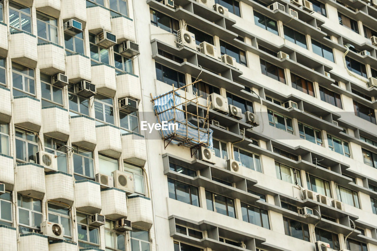 LOW ANGLE VIEW OF APARTMENT BUILDING