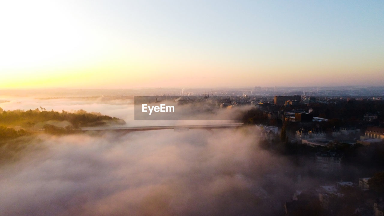 Drone flight above a valley in luxembourg-city suring sunrise