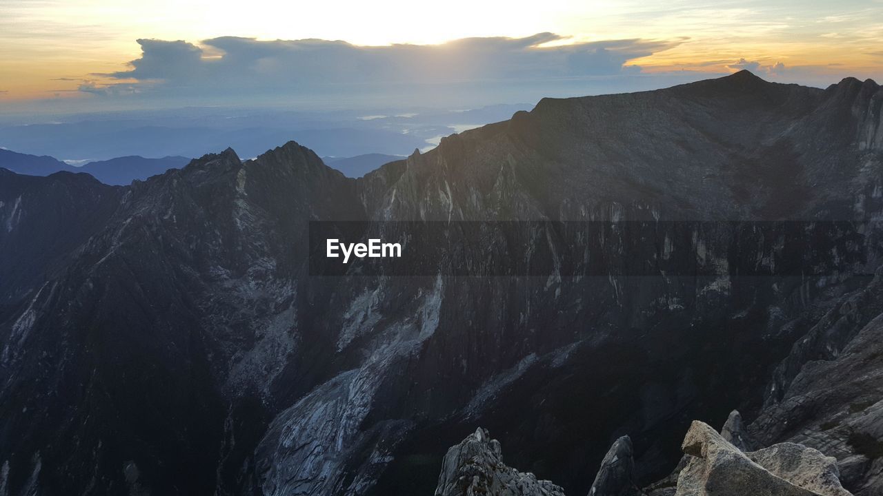 Scenic view of mountains at sunset