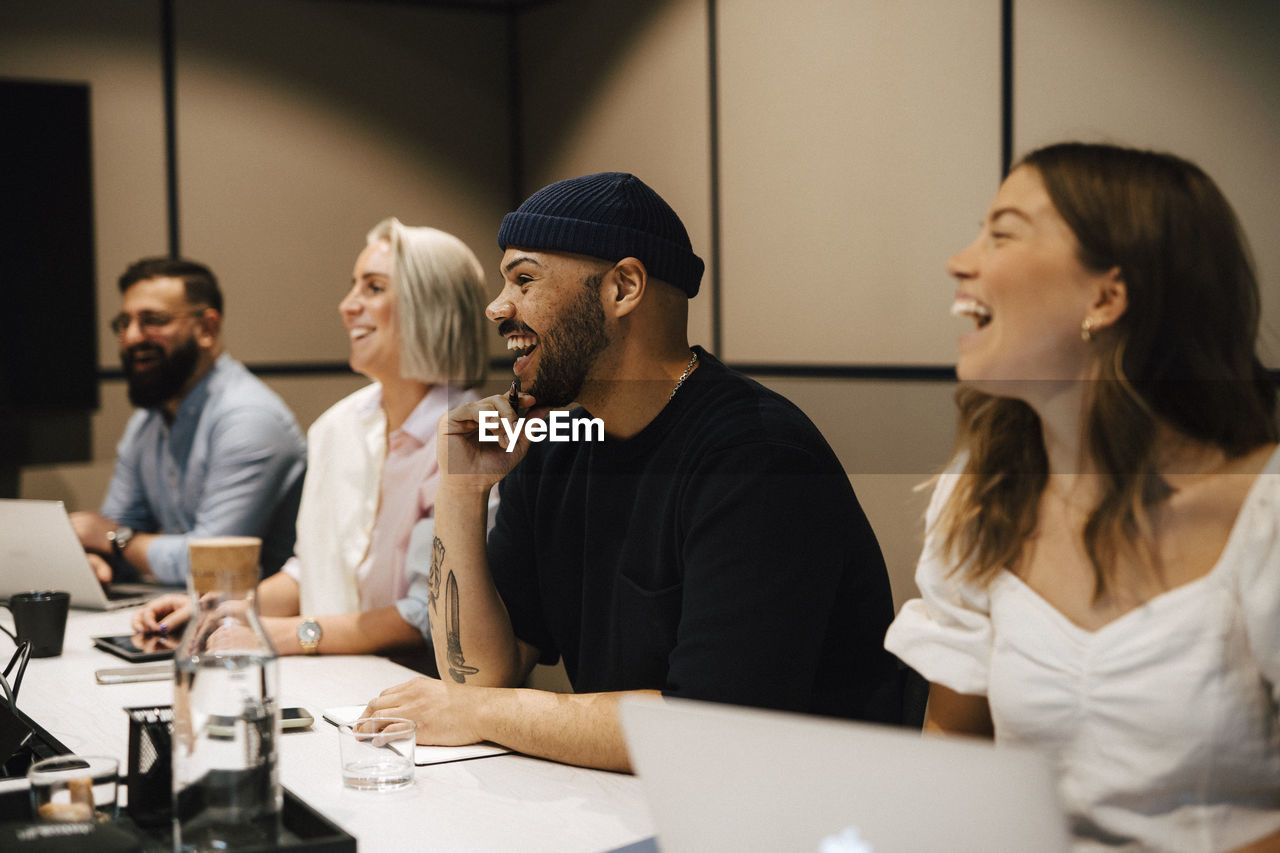 Coworkers having meeting in office