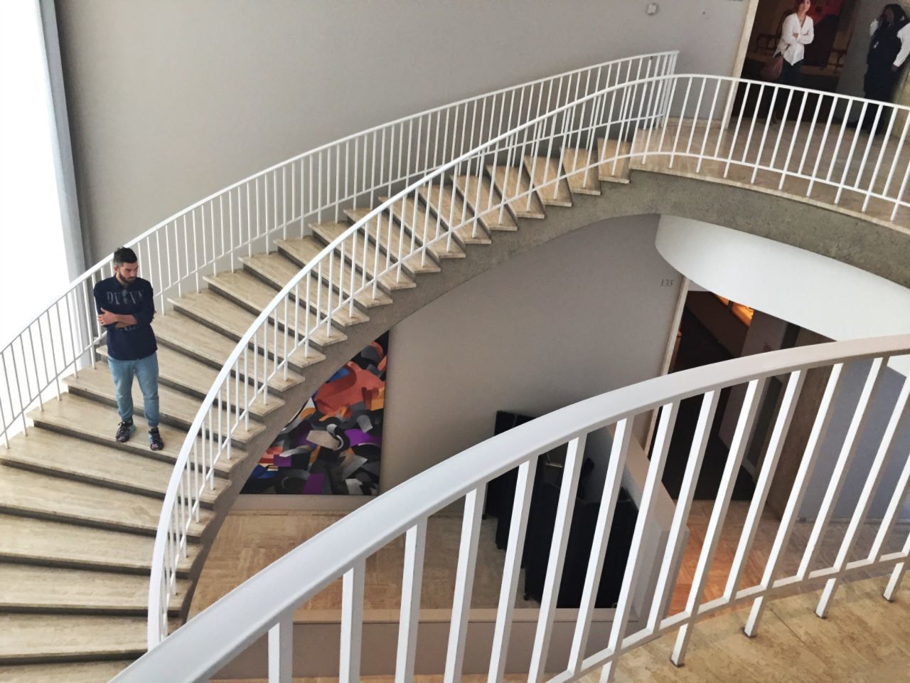 MAN WALKING UP STAIRS