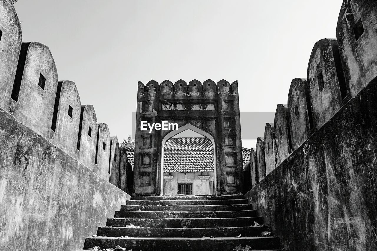 Low angle view of steps against clear sky
