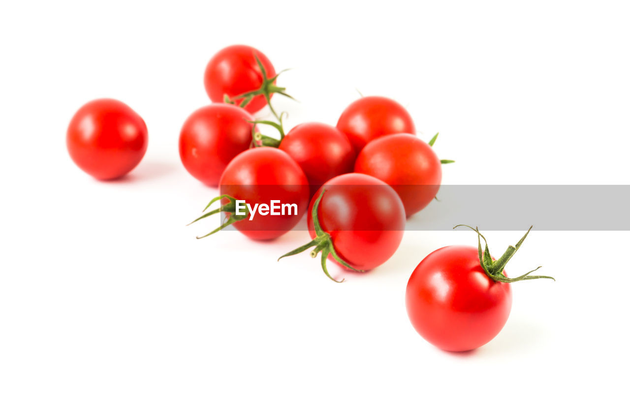 Close-up of cherry tomatoes on white background