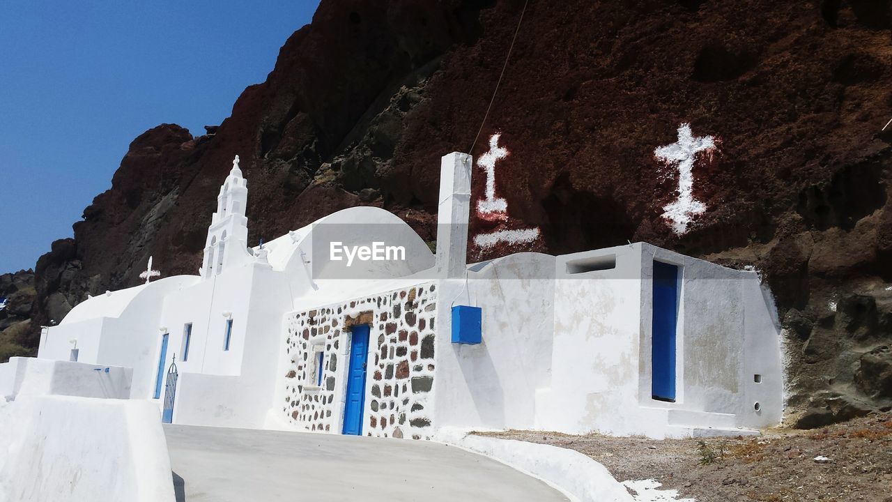 Chapel against mountain at santorini