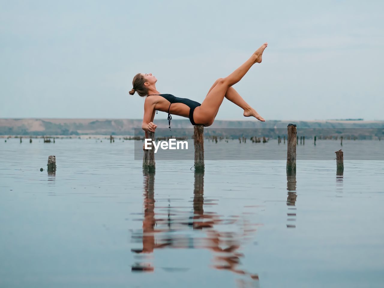Full length of woman exercising outdoors