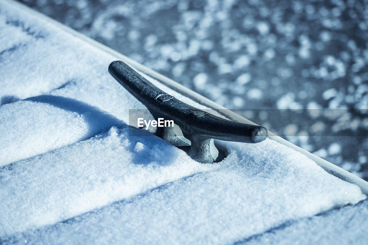 High angle view of cleat on snow covered pier