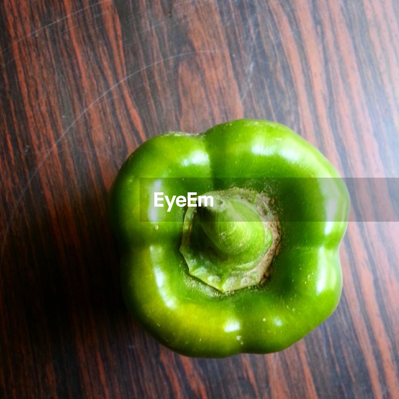 Directly above shot of green bell pepper on table