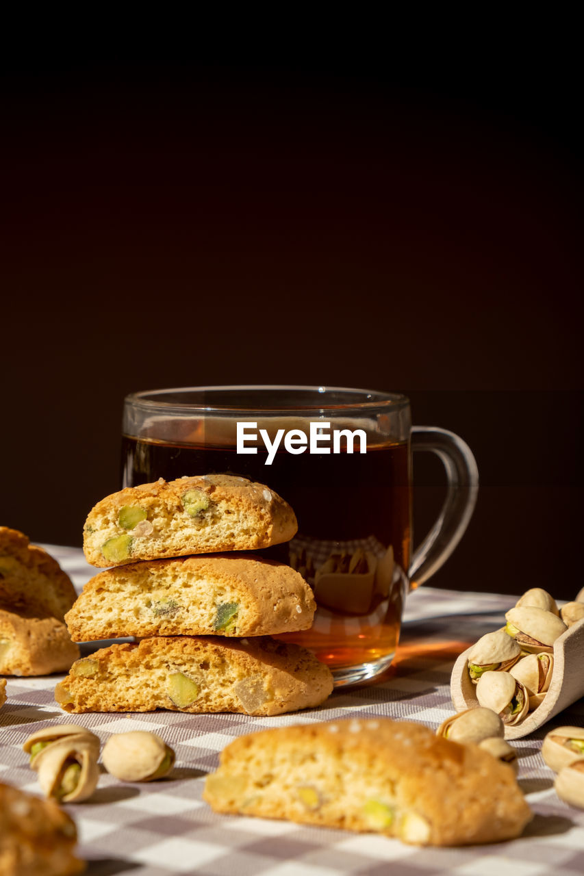 Biscotti cantuccini cookie biscuits with pistachios and lemon peel shortbread. cup of tea. teatime