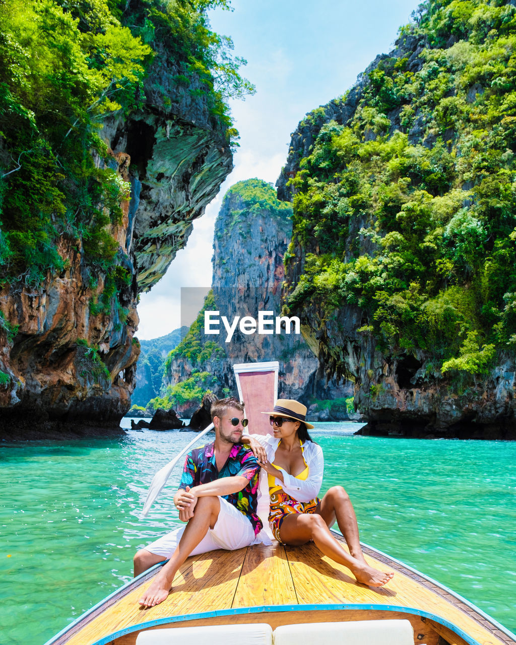 portrait of young woman sitting in boat in sea