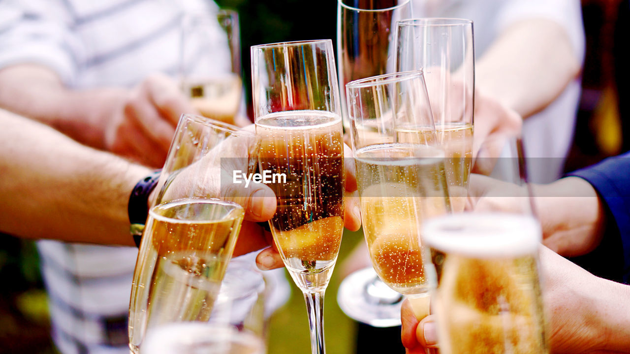 People cheering with champagne glasses 