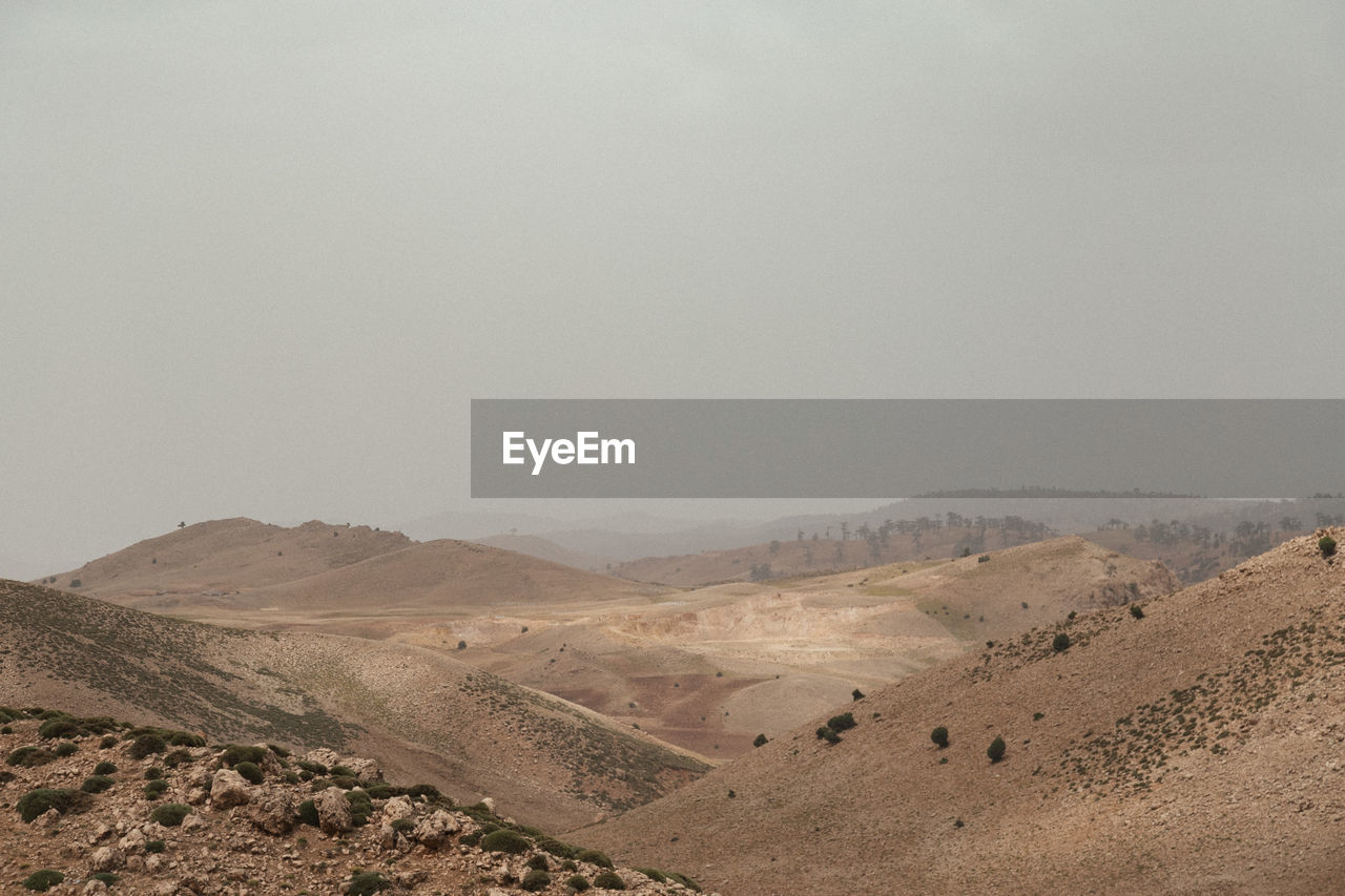 Scenic view of desert against clear sky