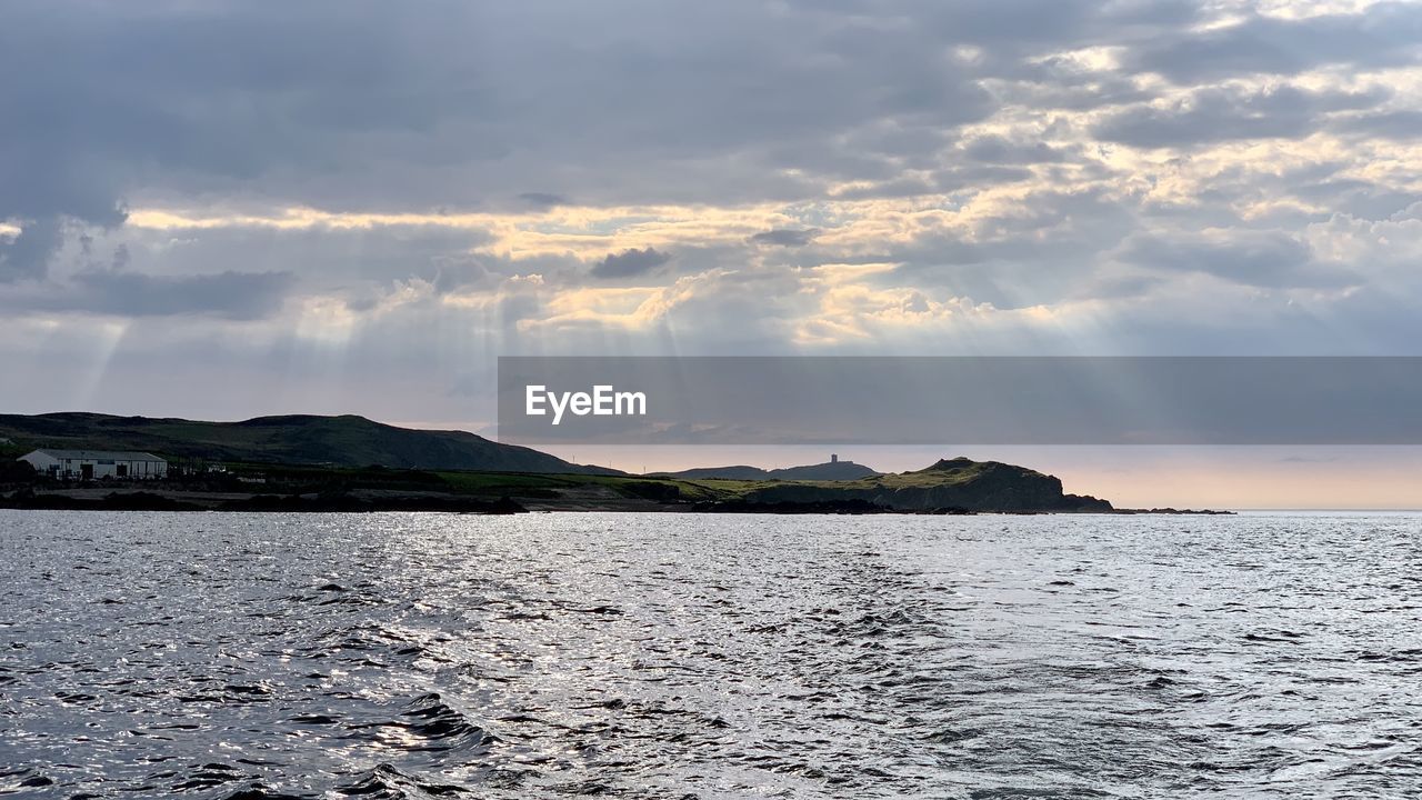 Panoramic view of sea against sky during sunset