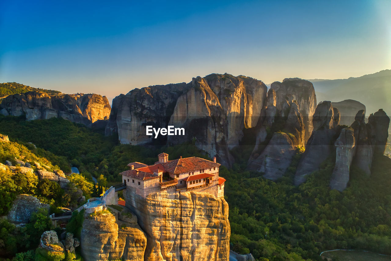 Aerial view of house on rock formation