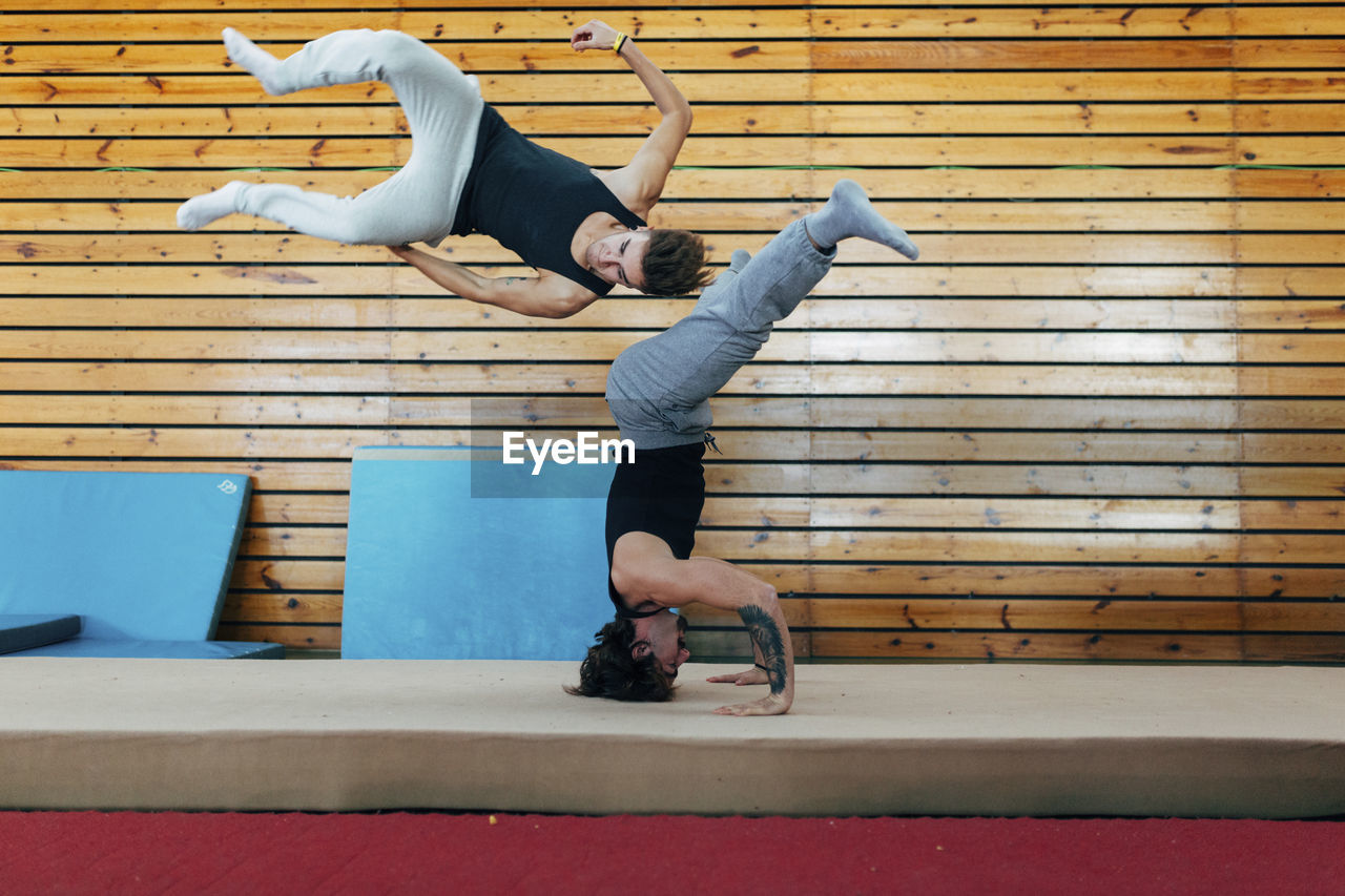 Gymnasts practicing gymnastics at gym