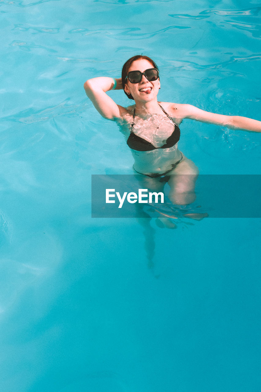 Young woman swimming in sea