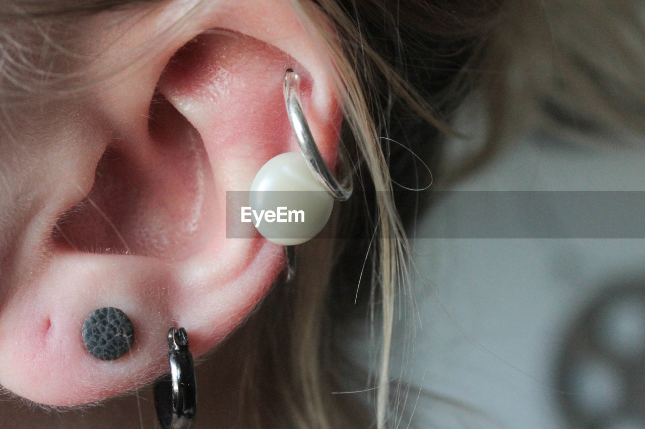 Cropped image of woman wearing earrings