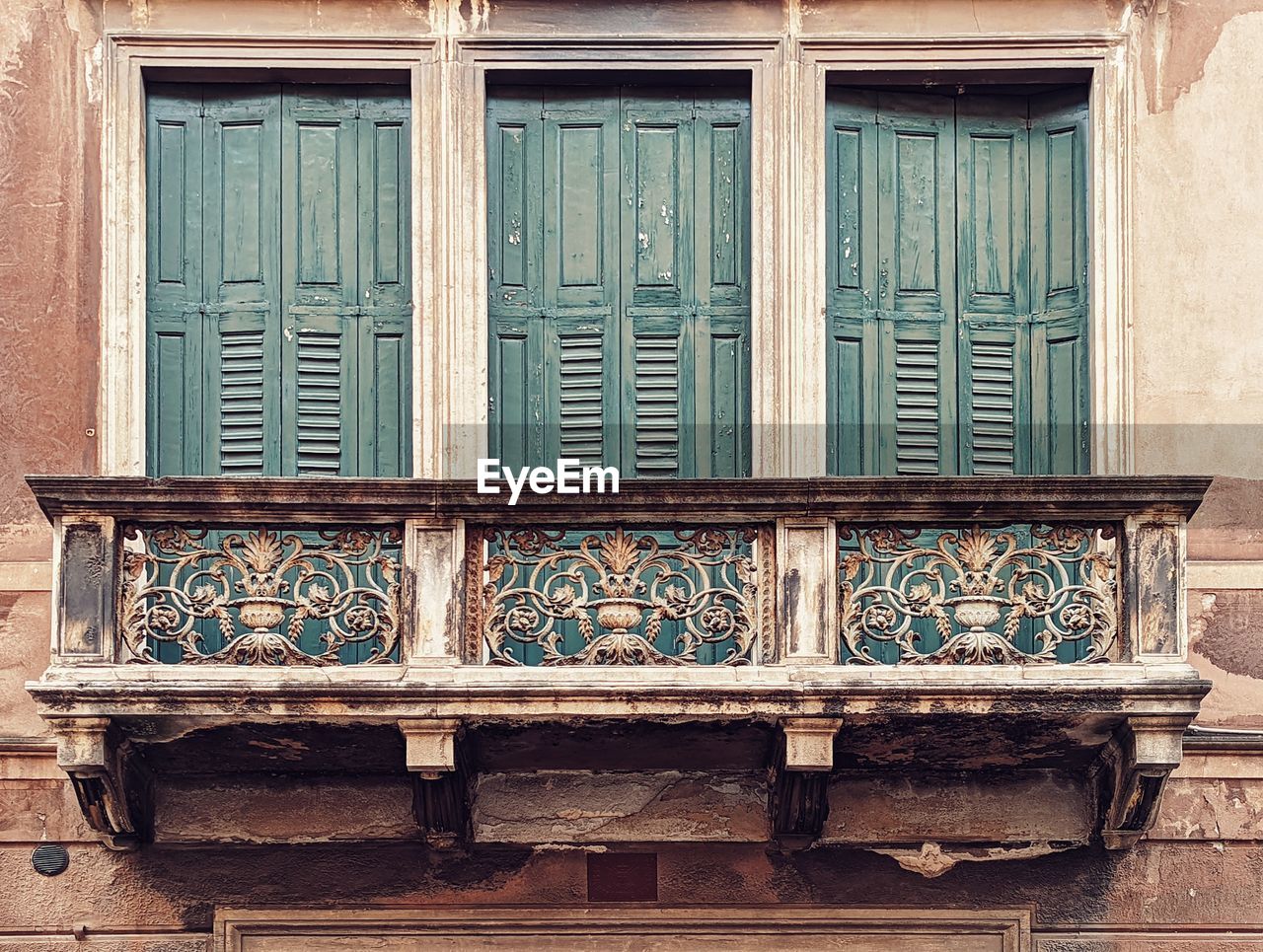 architecture, building exterior, built structure, window, wood, iron, no people, building, day, furniture, closed, house, residential district, outdoors, door, old, entrance, wall - building feature, pattern, city, facade, history, balcony
