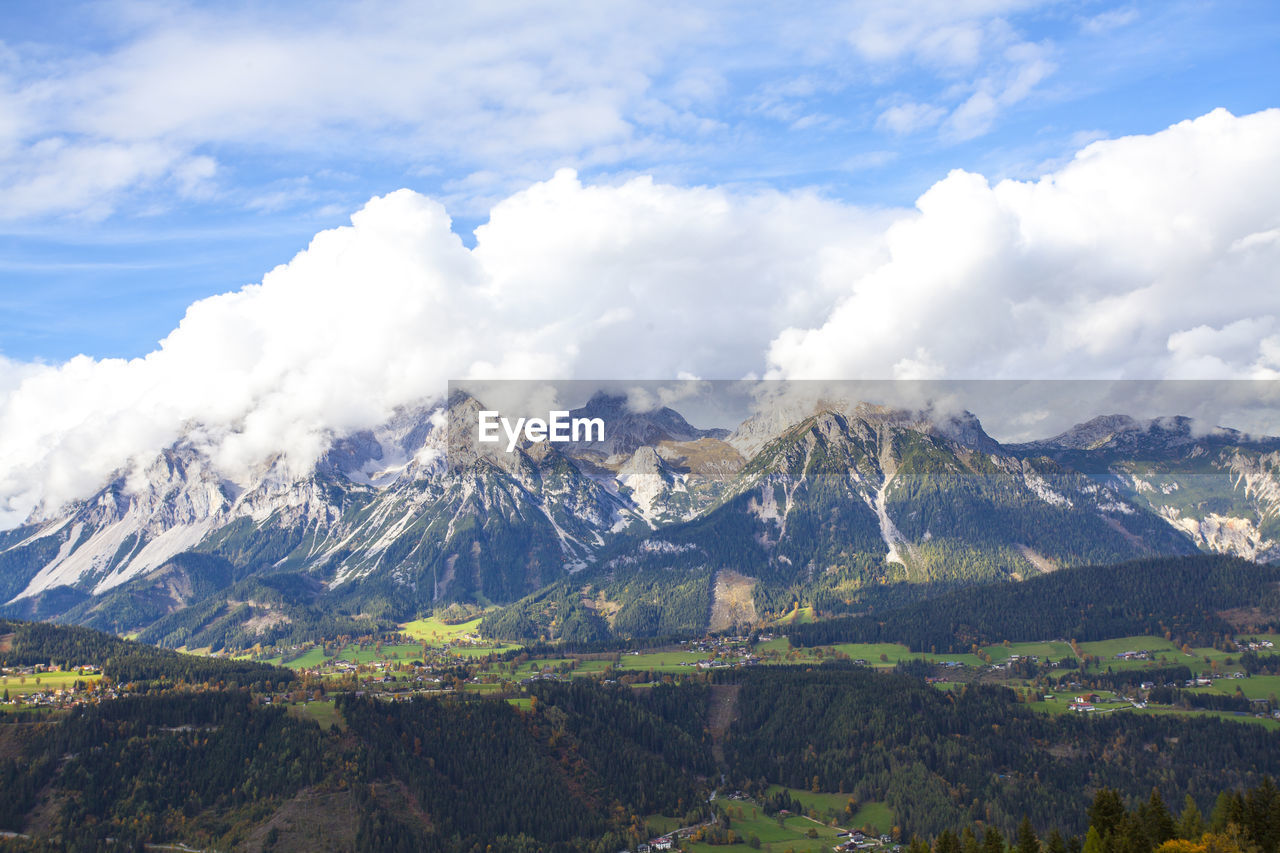 Scenic view of mountains covered with clouds