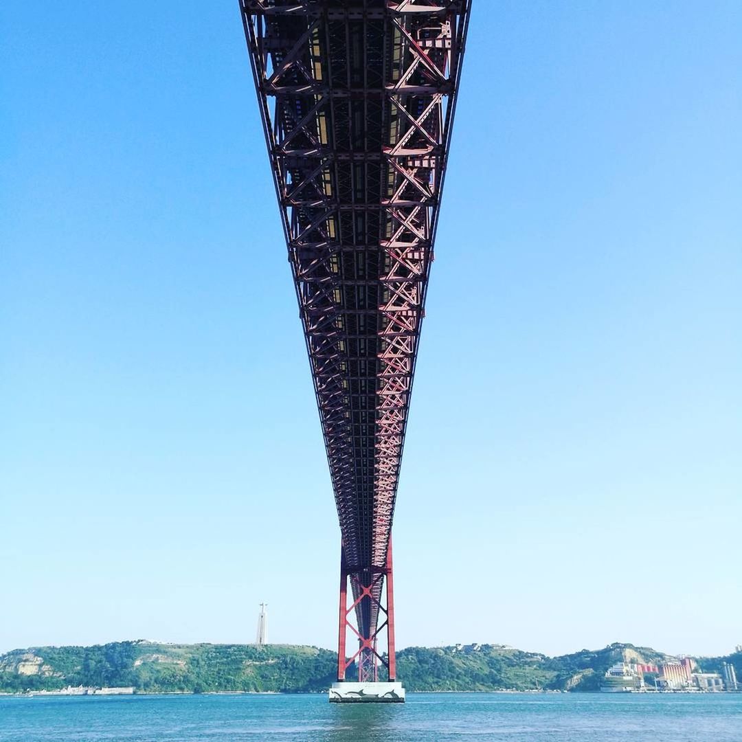 LOW SECTION OF MAN STANDING ON BRIDGE