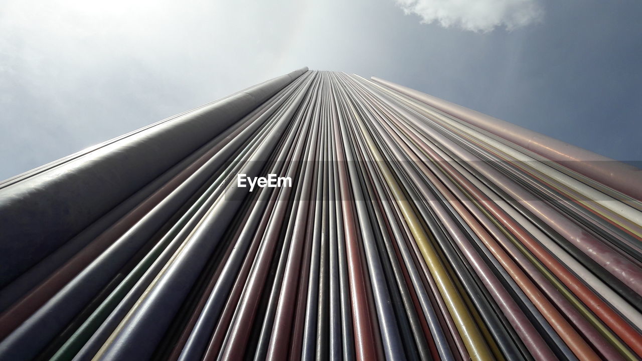 Low angle view of striped tower monument at la defense