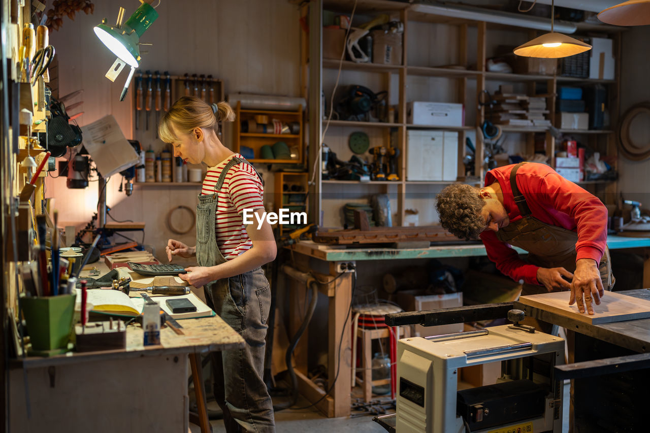 rear view of man working in workshop