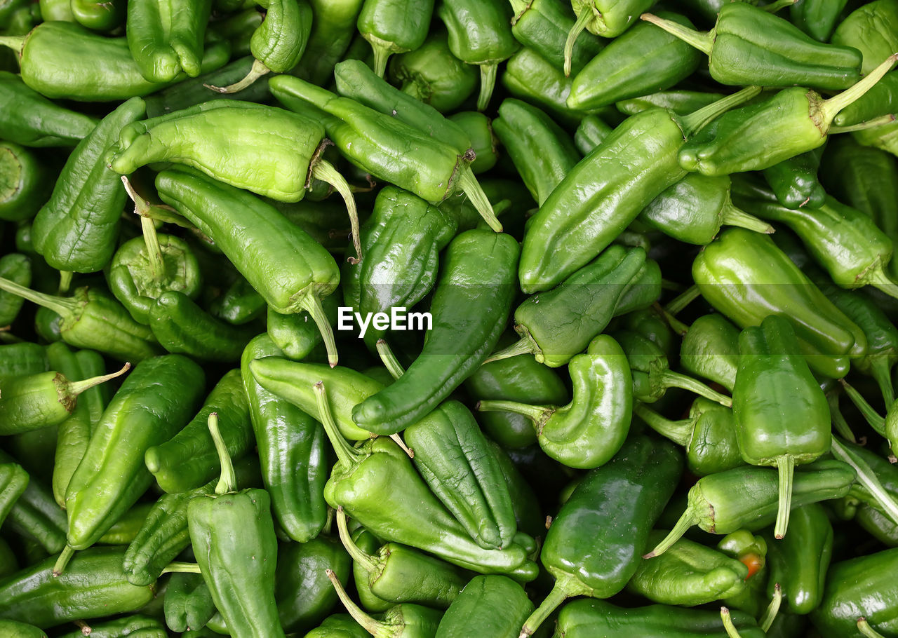 Full frame shot of green chili peppers for sale