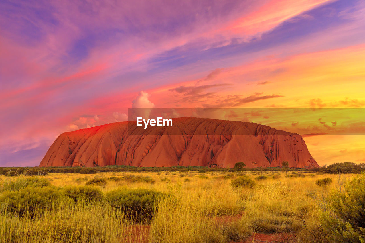 Scenic view of landscape against sky during sunset