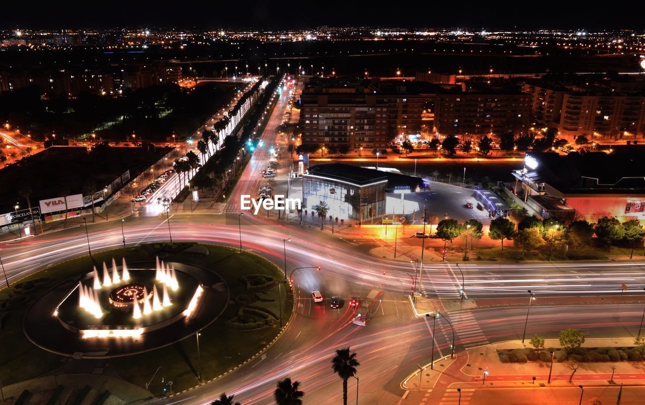 High angle view of light trails on city street at night