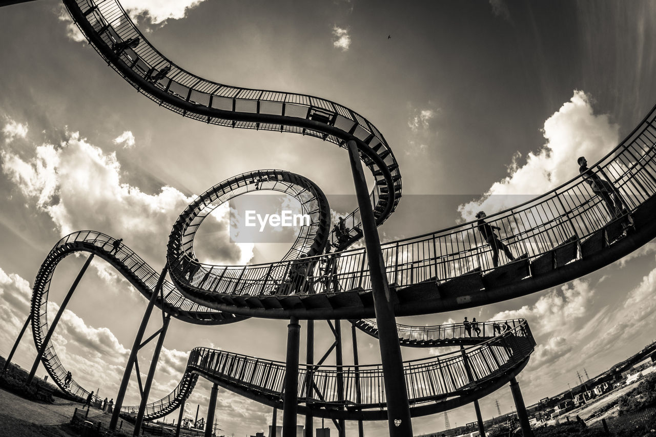 LOW ANGLE VIEW OF CHAIN SWING RIDE AGAINST SKY