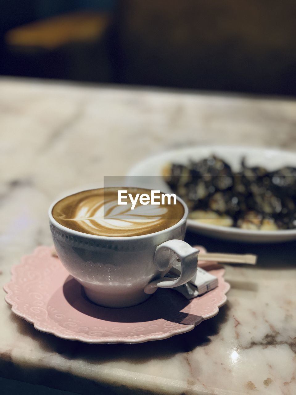 Close-up of cappuccino on table