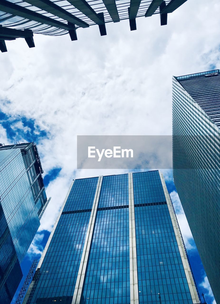 Low angle view of modern buildings against sky