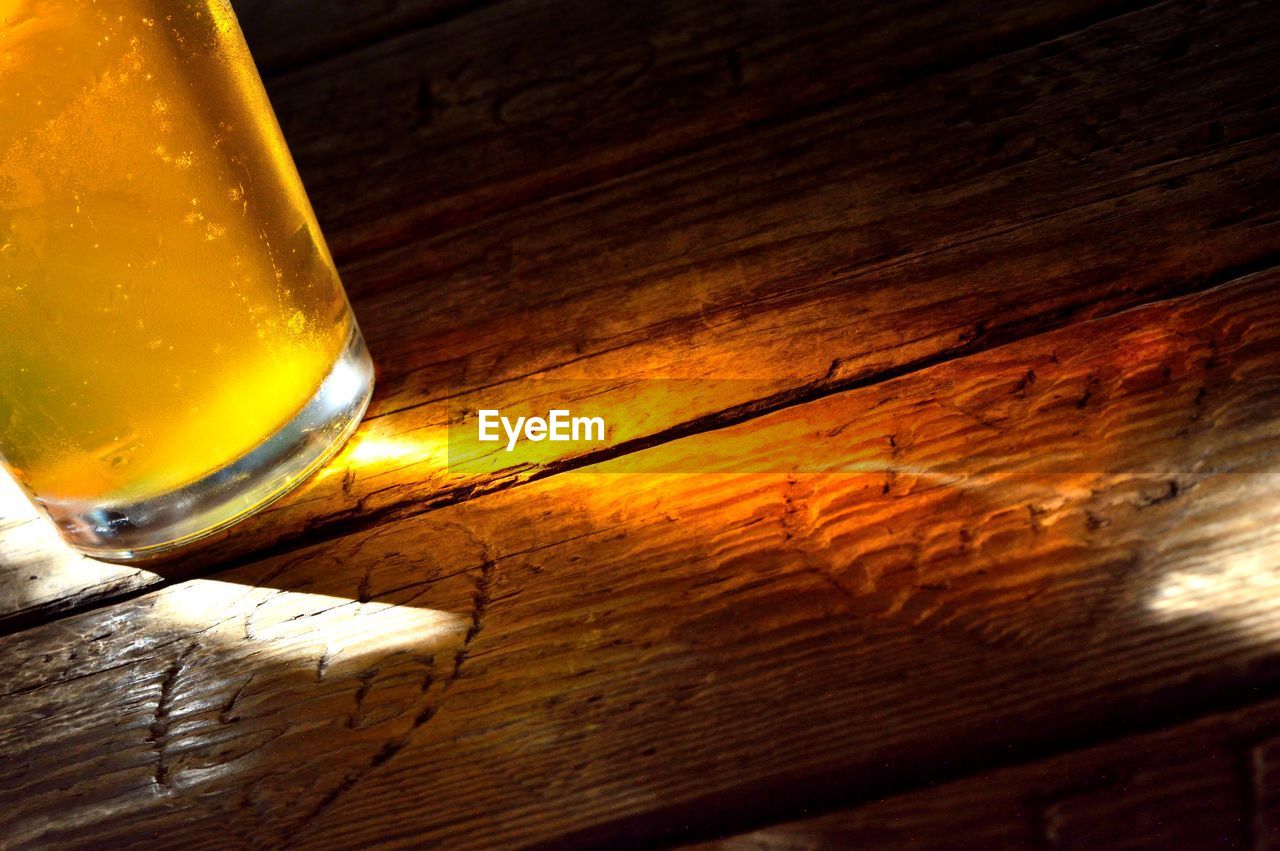 Close-up of beer glass on table