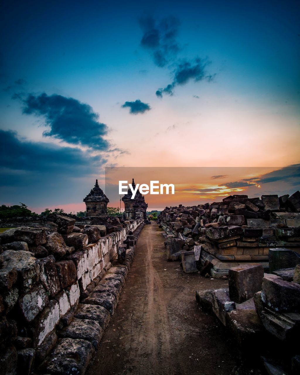 PANORAMIC VIEW OF BUILDINGS AGAINST SKY AT SUNSET