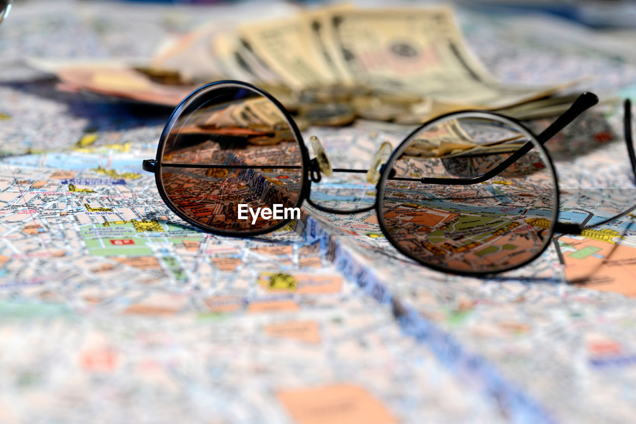 CLOSE-UP OF EYEGLASSES ON TABLE