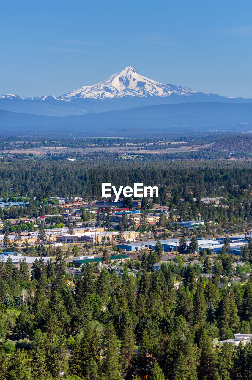 Scenic view of mt jefferson and town against sky